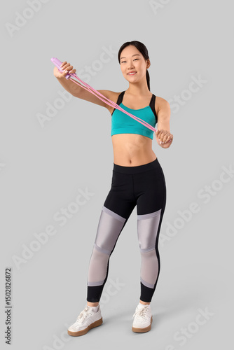 Sporty young Asian woman wi...