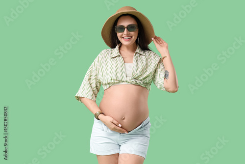 Young pregnant woman in sum...