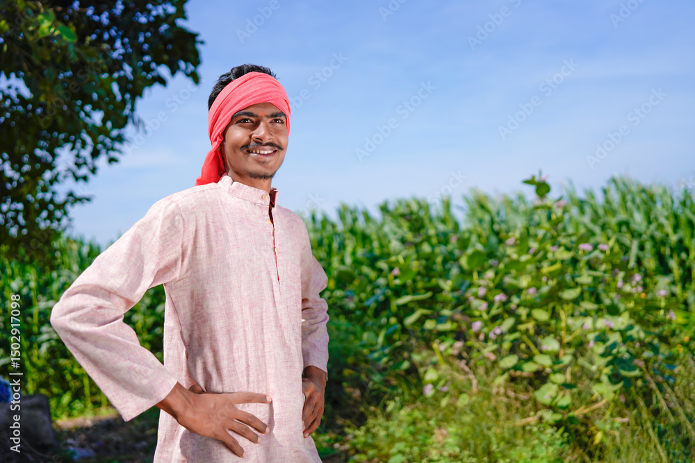 Fototapeta premium indian farmer standing confidently at agriculture field