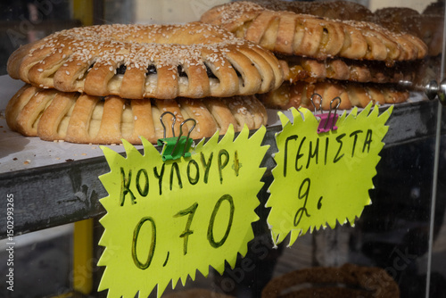 Fototapeta Naklejka Na Ścianę i Meble -  Traditional pastries and Greek bagels are a popular street food snack sold from street carts and bakeries, a typical breakfast food in Greece.