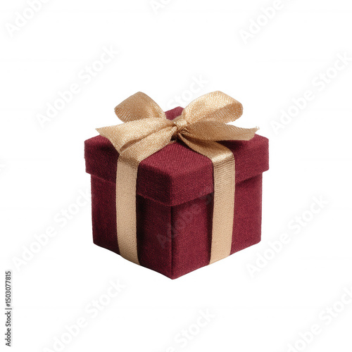 Small luxurious gift box in deep burgundy color, adorned with a shiny gold ribbon, ideal for special occasions like birthdays or anniversaries, against a white isolated background.