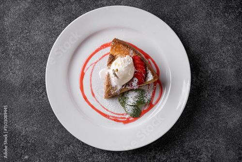 Quadro em tela Experience the exquisite presentation of a gourmet dessert featuring fresh strawberries, creamy ice cream, and a vibrant berry sauce