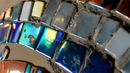 Wallpaper Mural Close-up abstract view of a mosaic surface, comprised of blue, silver, iridescent, and bronze square tiles set in grout with angled light. Torontodigital.ca