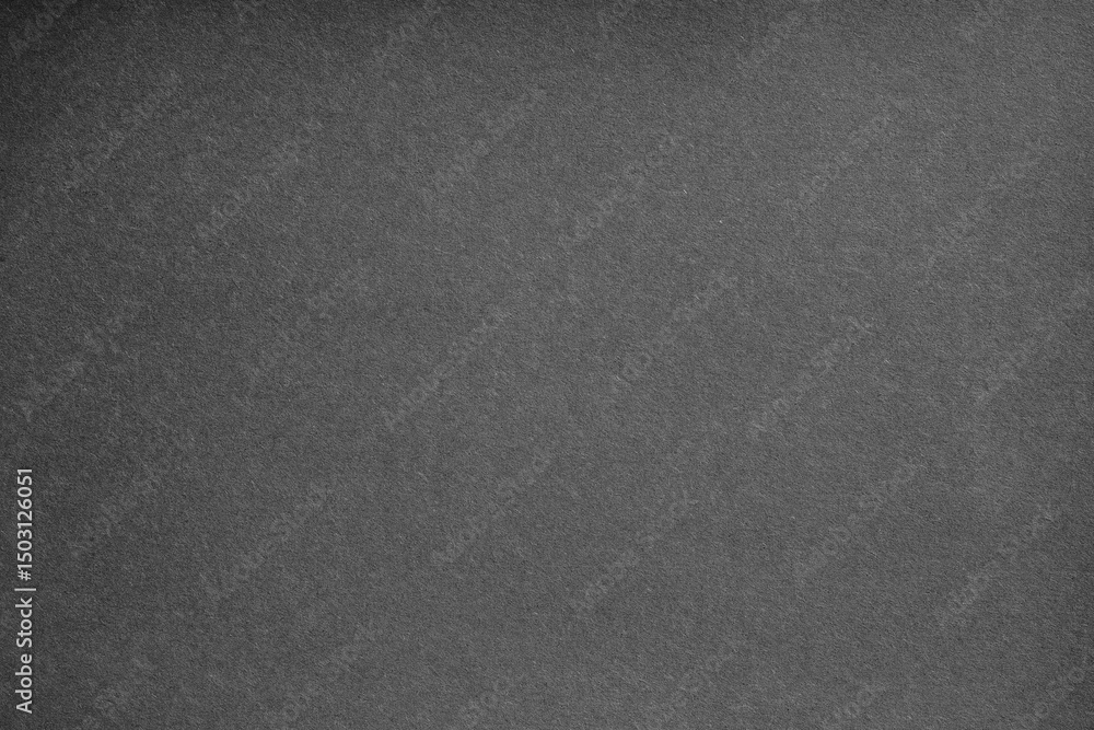Fototapeta premium Macro close-up of black paper material with grainy detail