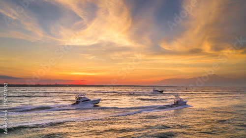 Headed to the deep sea fishing grounds at sunrise