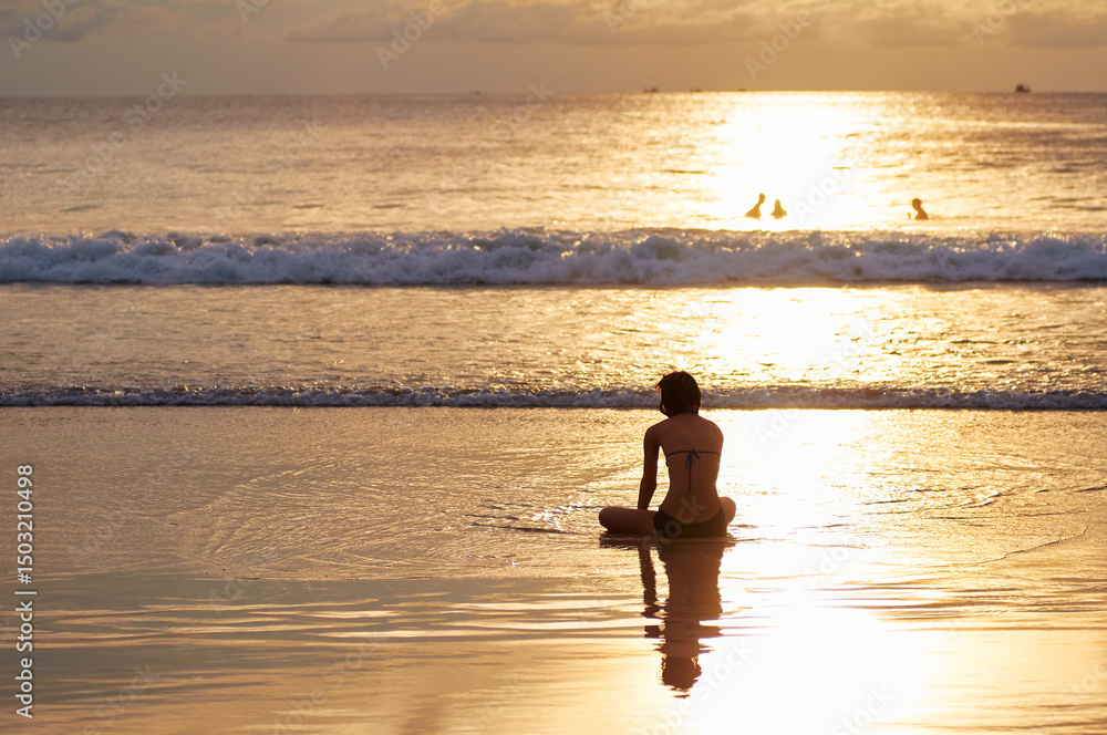 Relaxing Beach Scene at Sunset with People Enjoying the Ocean Relaxing Beach Scene at Sunset with People Enjoying the Ocean