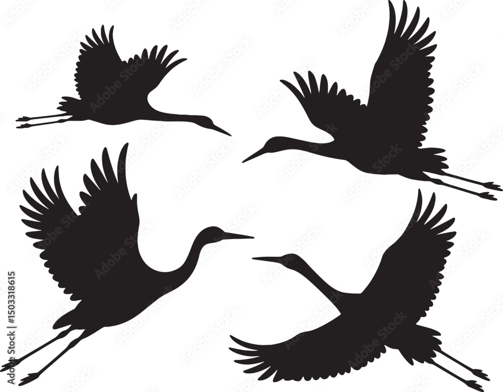 Fototapeta premium Four silhouettes of cranes in flight graceful birds