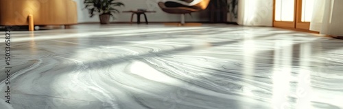 Light-toned, marbled floor with sunlit patterns