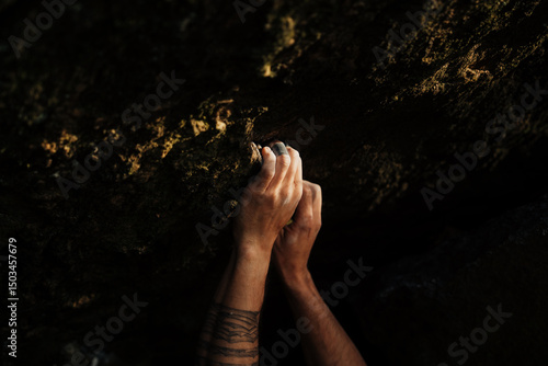 Climber's hand on a rock