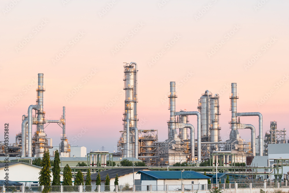 Fototapeta premium Oil gas refinery plant or petrol chemical plant at duck sky background. Heavy industry in Map Ta Phut Industrial Estate to processing, manufacturing petroleum products i.e. diesel fuel and gasoline.