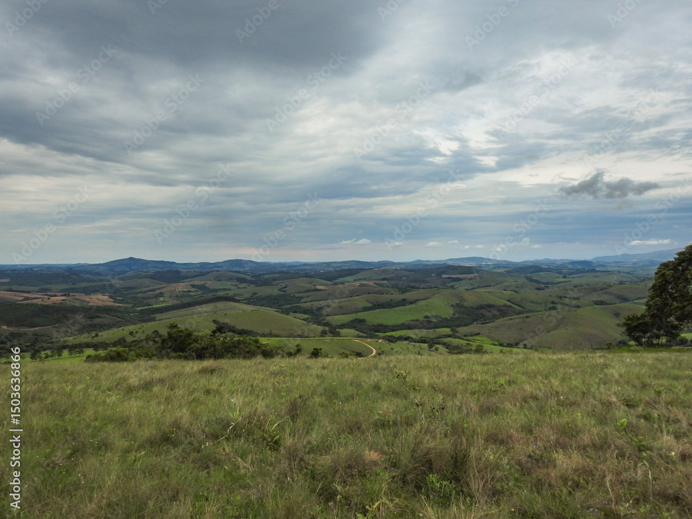 Naklejka premium landscape with hills and moody sky