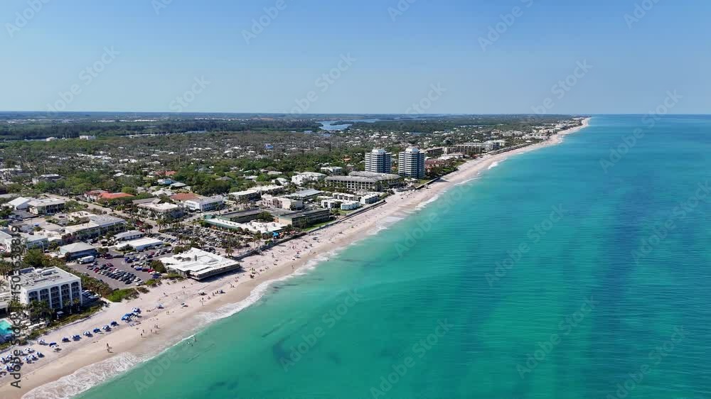 Aerial view along the coastline on a beautiful sunny summer beach day in Vero Beach located in Indian River County, Florida. Aerial view along the coastline on a beautiful sunny summer beach day in Vero Beach located in Indian River County, Florida.