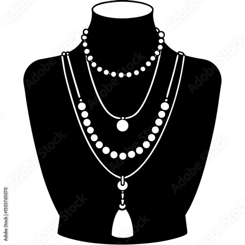 Layered pearl necklaces on a bust form
