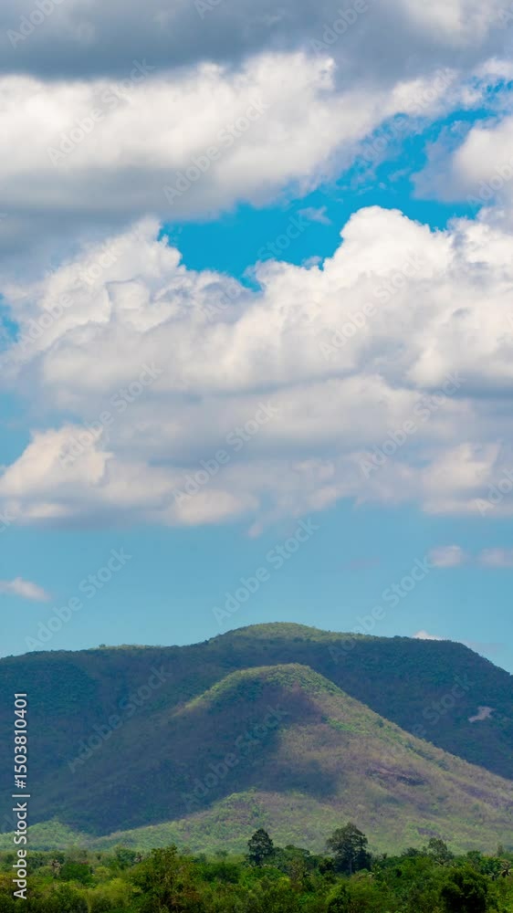 Vertical video time lapse of white clouds and blue sky with mountains, nature view during the day. Climate and weather concept Vertical video time lapse of white clouds and blue sky with mountains, nature view during the day. Climate and weather concept
