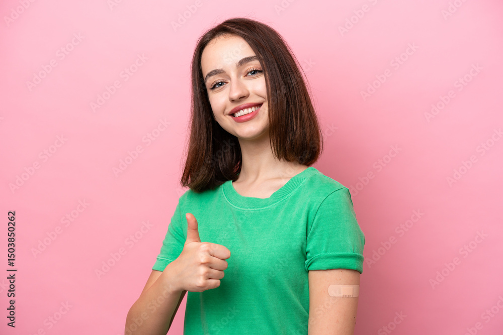 Young Ukrainian woman wearing a band aids with thumbs up because something good has happened Young Ukrainian woman wearing a band aids with thumbs up because something good has happened