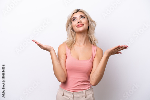 Wallpaper Mural Young Russian woman isolated on white background making doubts gesture Torontodigital.ca