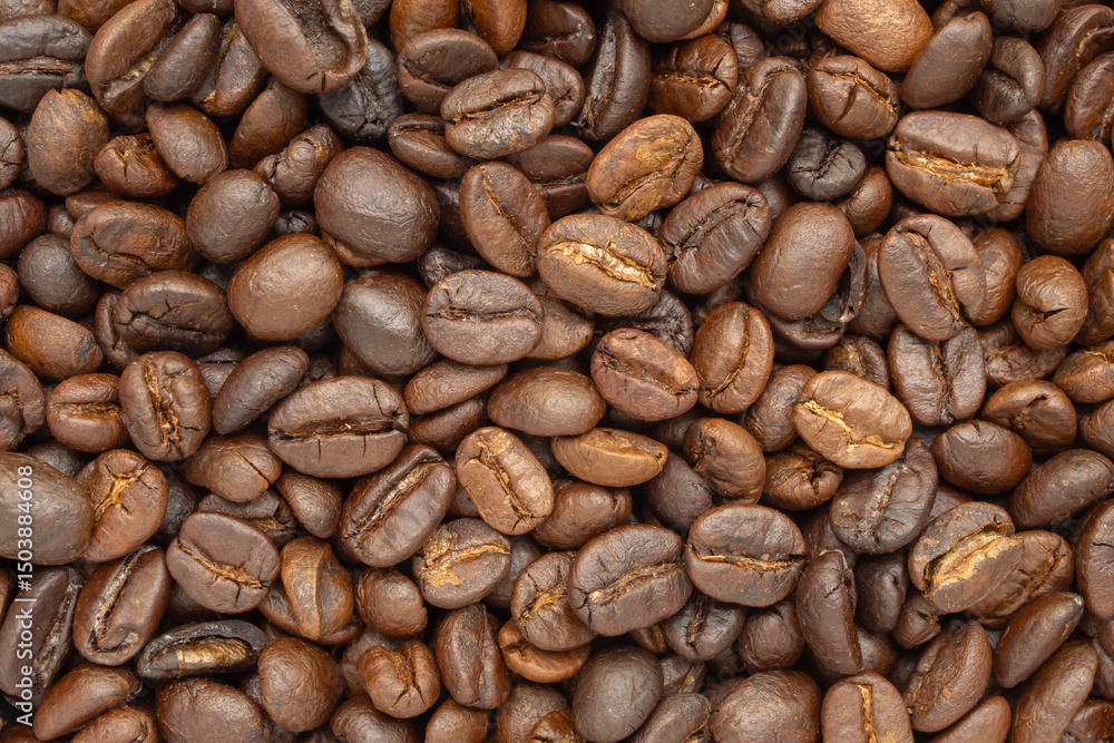 Naklejka premium Fresh premium roasted brown Arabica coffee beans background