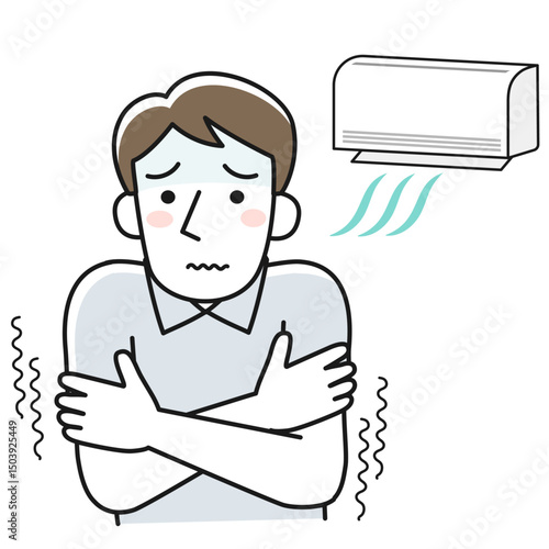 冷房が効きすぎて寒さに震える男性