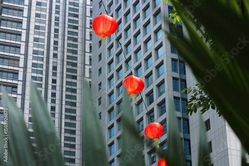 Photography Chinese New Year red paper lanterns hanging in Kuala Lumpur city, view through p