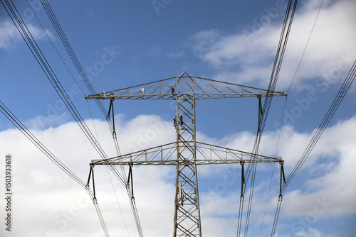 Wallpaper Mural Painters in secure clothing work on a high-voltage mast Torontodigital.ca