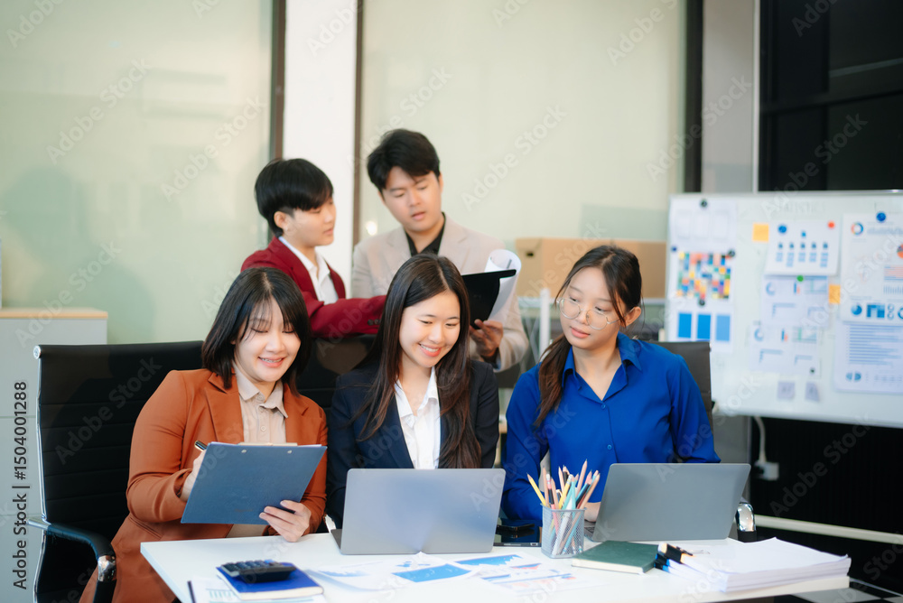 Young business creative team are brainstorming planning discussing while sitting in creative business discussing work Young business creative team are brainstorming planning discussing while sitting in creative business discussing work