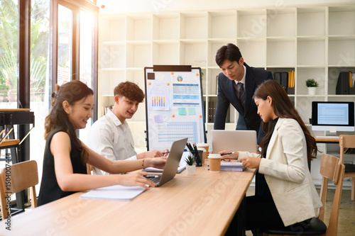 Photography Diverse Business team collaborating during a meeting in a modern sunlit office