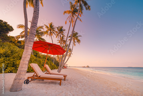 Fototapeta Naklejka Na Ścianę i Meble -  Beautiful panoramic sea sand sky. Tropical relax beach sunny summer island landscape. Love couple chairs umbrella palm leaves romantic coast. Luxury travel destination. Honeymoon vacation best holiday