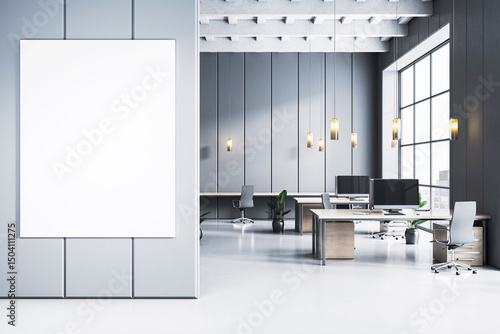 Fototapeta Naklejka Na Ścianę i Meble -  Blank vertical poster mockup on light wall in contemporary luxury office interior with desks, computers, pendant lights, and city view windows. 3D Rendering
