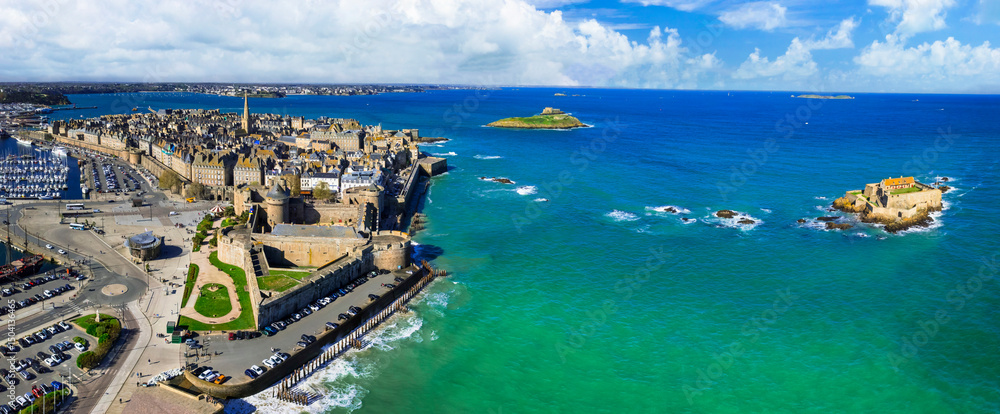 Fototapeta premium France travel and landmarks. aerial panoramic view of Saint -Malo , historic French port in Ille-et-Vilaine, Brittany. drone view of old city and national fort on the island
