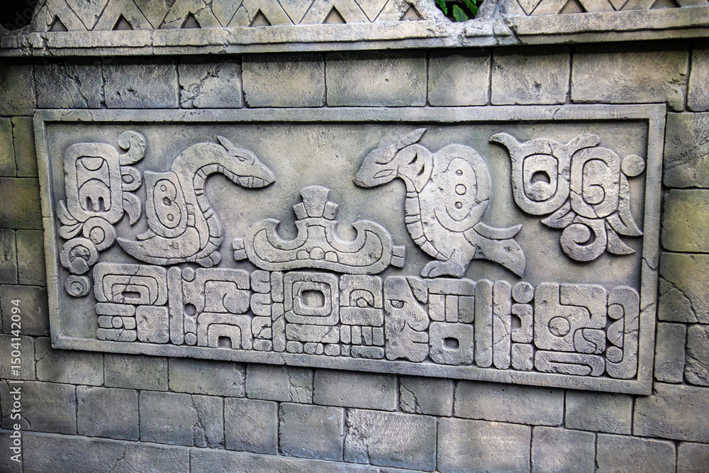 Bas-relief with antique drawings and inscriptions in a rectangle of stone. Medieval architecture, world tourism. Bas-relief with antique drawings and inscriptions in a rectangle of stone. Medieval architecture, world tourism.