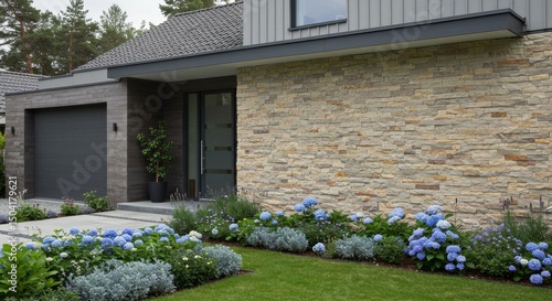 Modern Home Exterior with Stone Veneer and Landscaping - Contemporary house showcasing elegant stone veneer wall, complemented by a well-maintained garden with blooming hydrangeas
