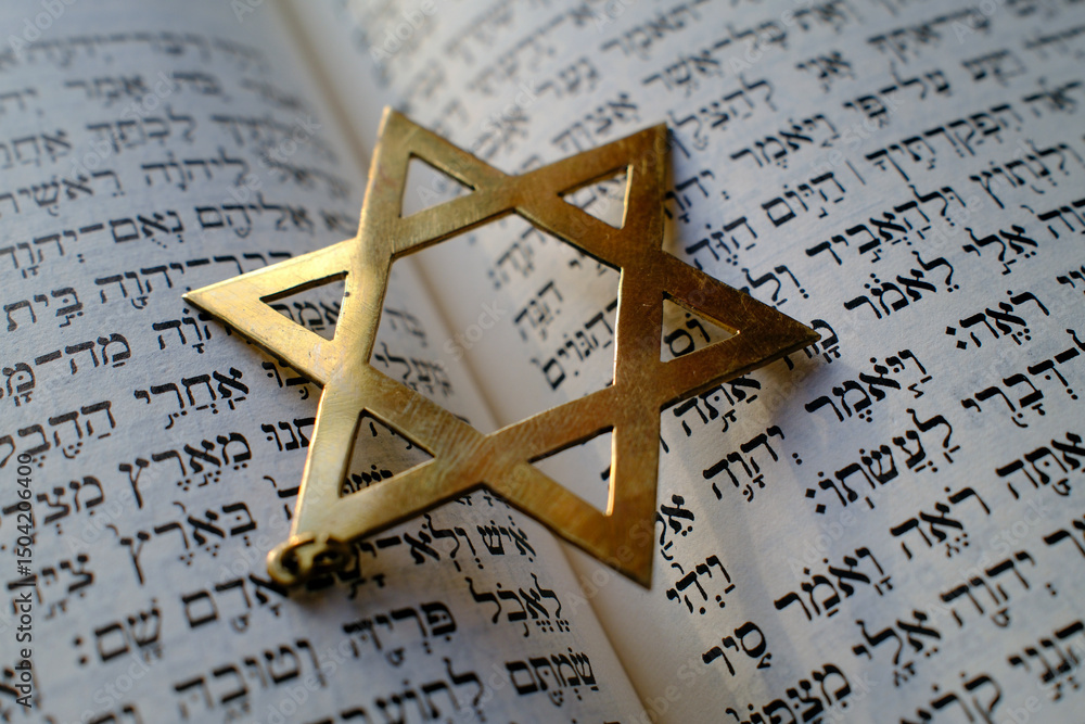 Fototapeta premium Judaism. The Bible in Hebrew with a star of David.