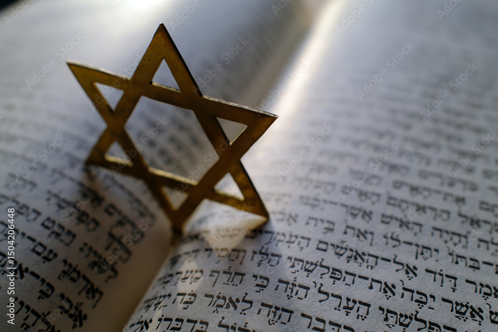 Fototapeta premium Judaism. The Bible in Hebrew with a star of David.
