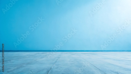 Empty room with light blue wall and concrete floor