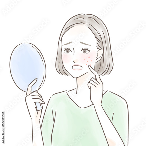 手鏡を見て湿疹にショックを受ける女性