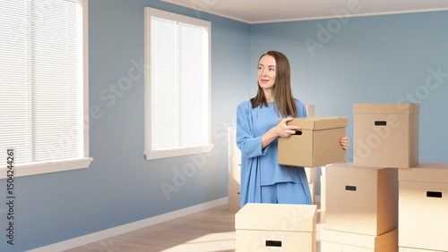 Woman moving. Unpacking box...