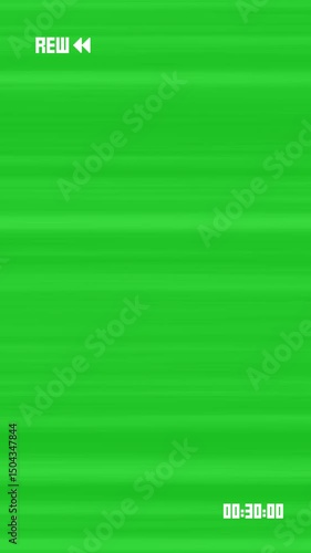 Portrait mode VHS tape rewind arrows icon symbol effect on 4k green screen backdrop Film overlay animation with chroma key with time code on screen retro vintage