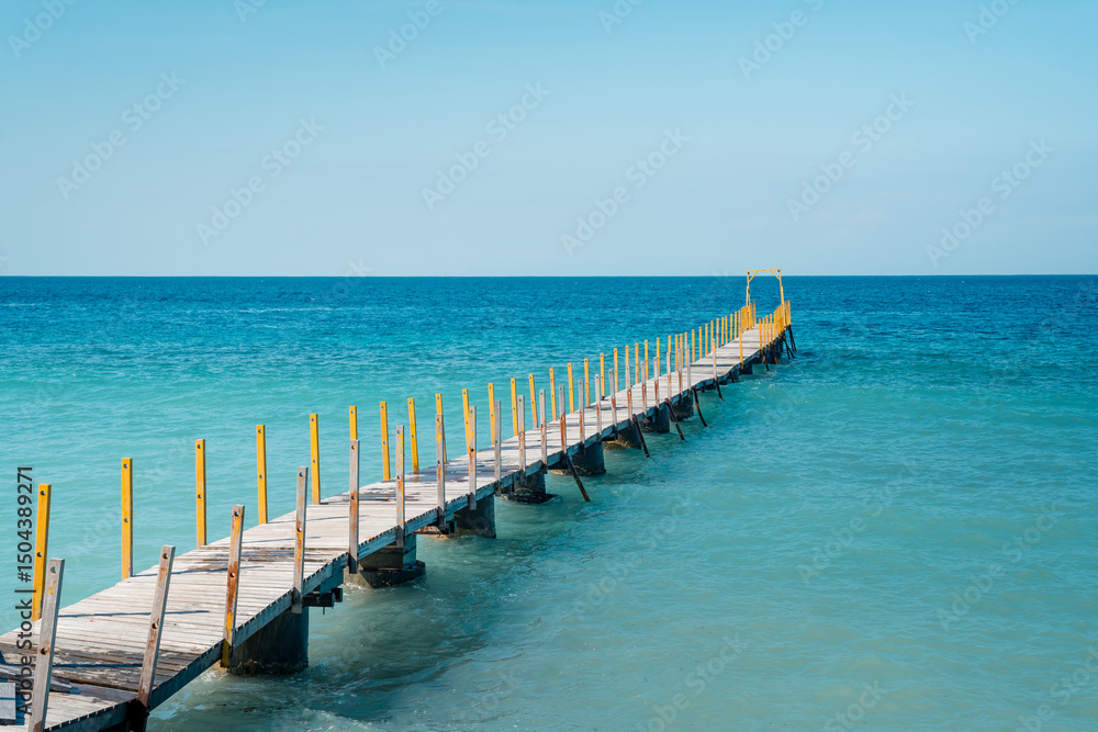 Wooden Pier Extending into the Blue Ocean Wooden Pier Extending into the Blue Ocean