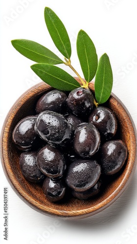 Black Olives in a Wooden Bowl With Fresh Leaves Displayed on a White Background