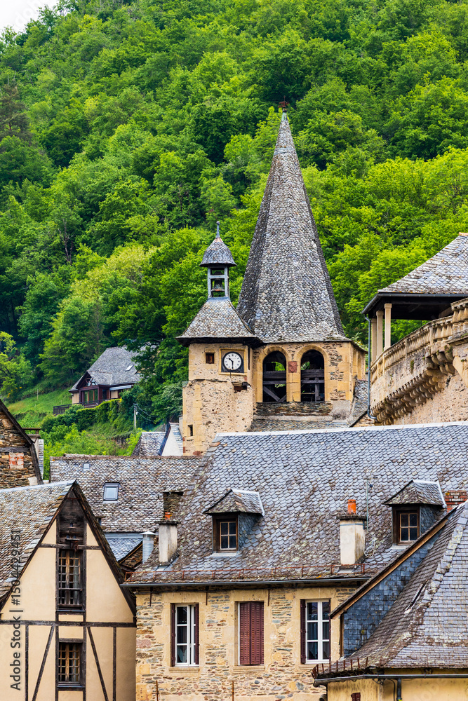 Bell tower of the Church of Saint-Fleuret in the village of Estaing Bell tower of the Church of Saint-Fleuret in the village of Estaing