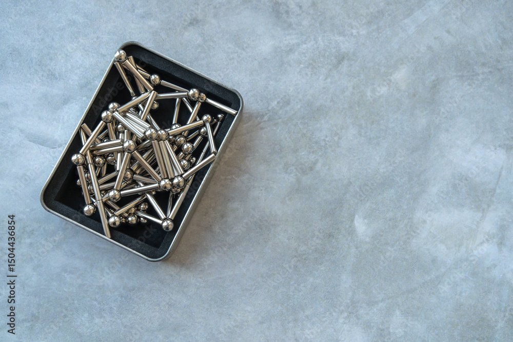Fototapeta premium The neocube magnetic construction kit is in a box on the table.Magnetic balls to play with.
