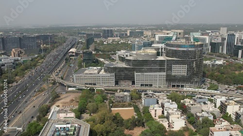 Drone Shot of DLF Cyber City Gurgaon – Aerial View of Iconic IT Hub with Glass Towers, Office Buildings, Skywalk, Metro Line, and Modern Infrastructure in Gurugram, India