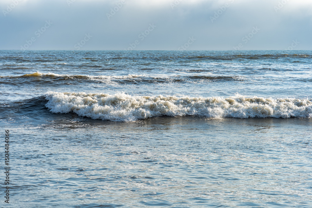 Fototapeta premium Dramatic view of a powerful ocean wave crashing along the coast of Lima, Peru