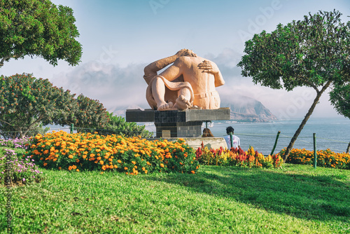 Idyllic scene from Parque del Amor with the iconic El Beso sculpture overlooking the Pacific Ocean.