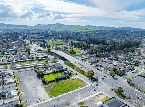 Aerial views of Central Avenue area showing open lots, residential housing, parking, and infrastructure near a major intersection and transit corridor.