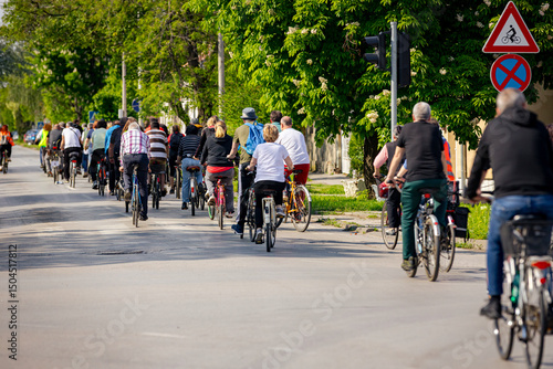 Group of cyclists on city road, street, asphalt