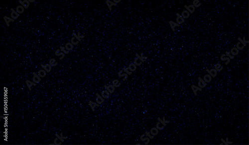 Snowfall on a black background. Flying dust particles on a black background