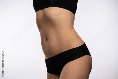 Fotografía Close Up of Womans Toned Midsection in Black Undergarments