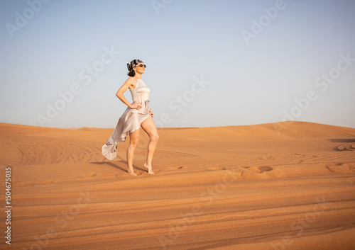 Wallpaper Mural Beautiful girls in a beautiful flowing dress in desert condition Torontodigital.ca