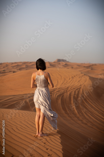 Wallpaper Mural Beautiful girls in a beautiful flowing dress in desert condition Torontodigital.ca